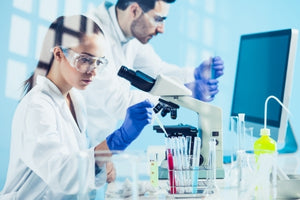 Scientists conducting lab experiments as part of BPC-157 peptide latest research 2025 in a modern laboratory